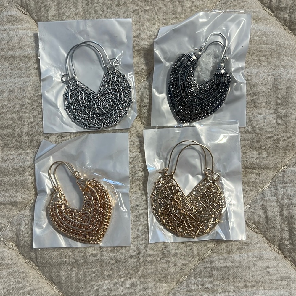 4 pairs of earrings new in package never worn